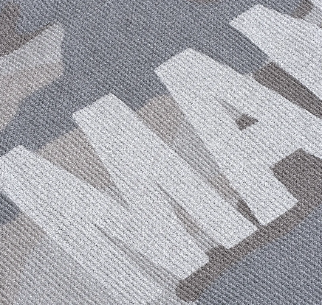 Gros plan sur une matière claire avec lettrage Mania.